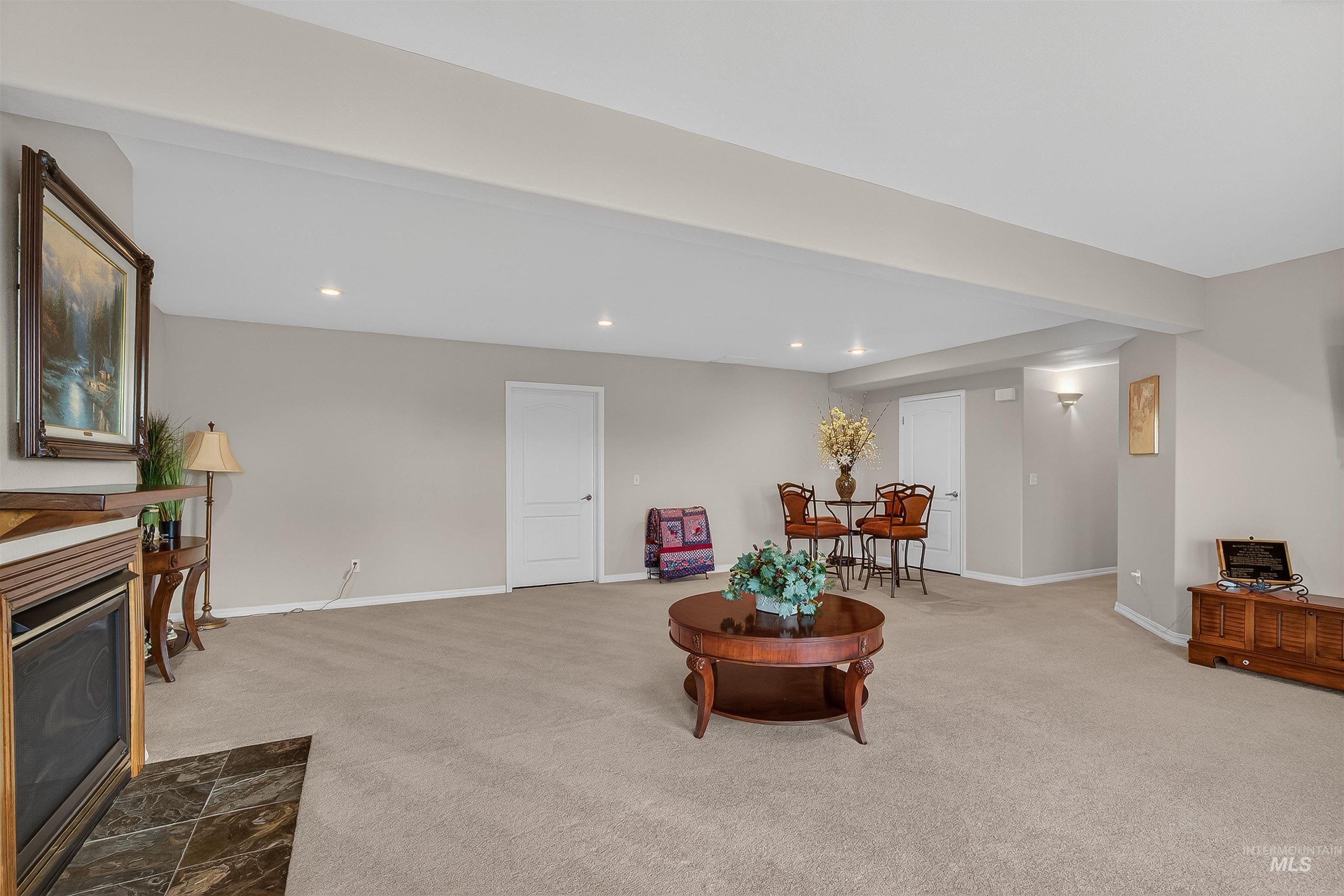 3978 Foothill Drive Lewiston, ID 83501 - Photo 31 of 40 Living area with recessed lighting, carpet floors, and a fireplace with flush hearth