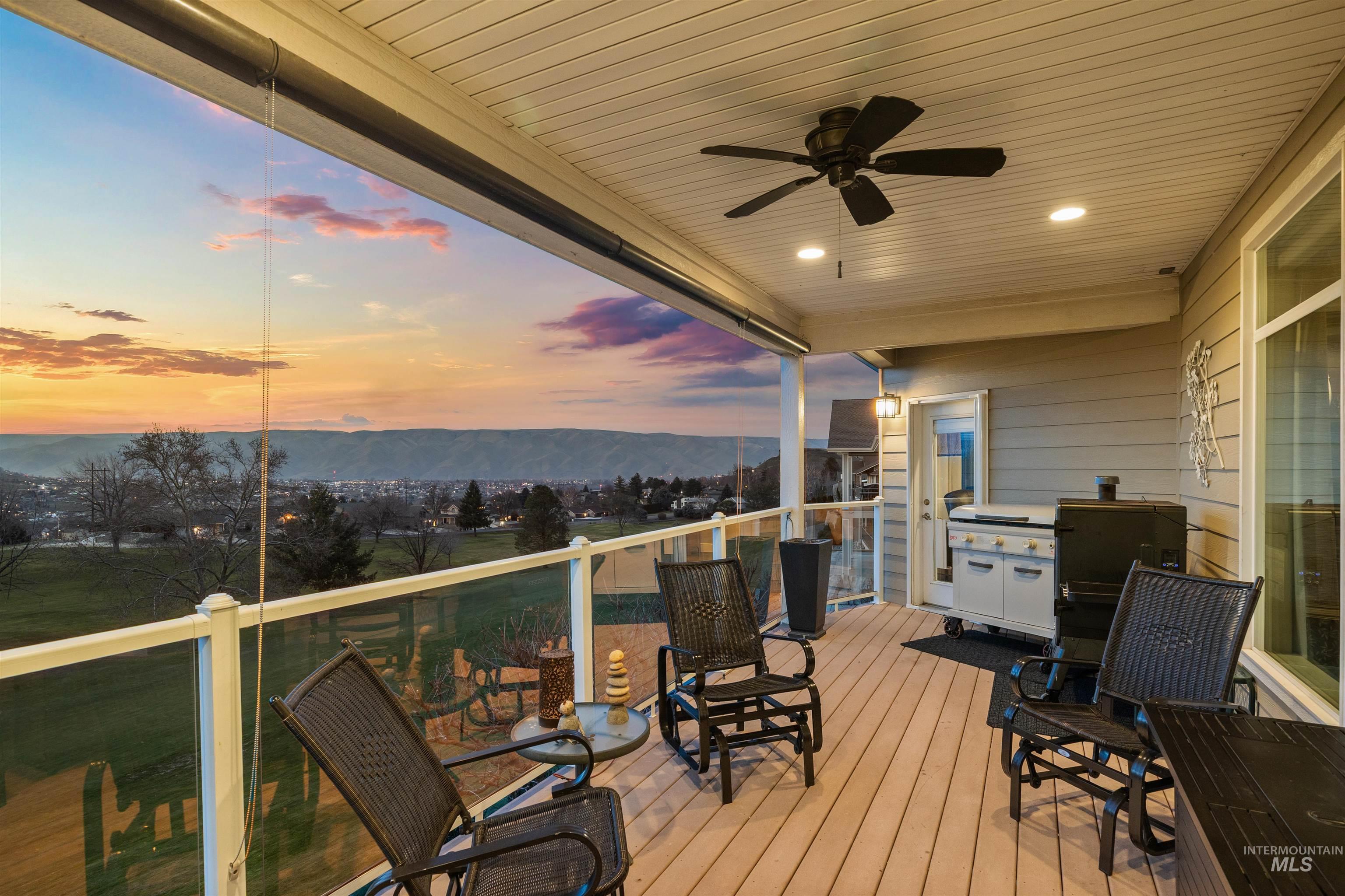 3978 Foothill Drive Lewiston, ID 83501 - Photo 32 of 40 Deck at dusk featuring a ceiling fan and a mountain view