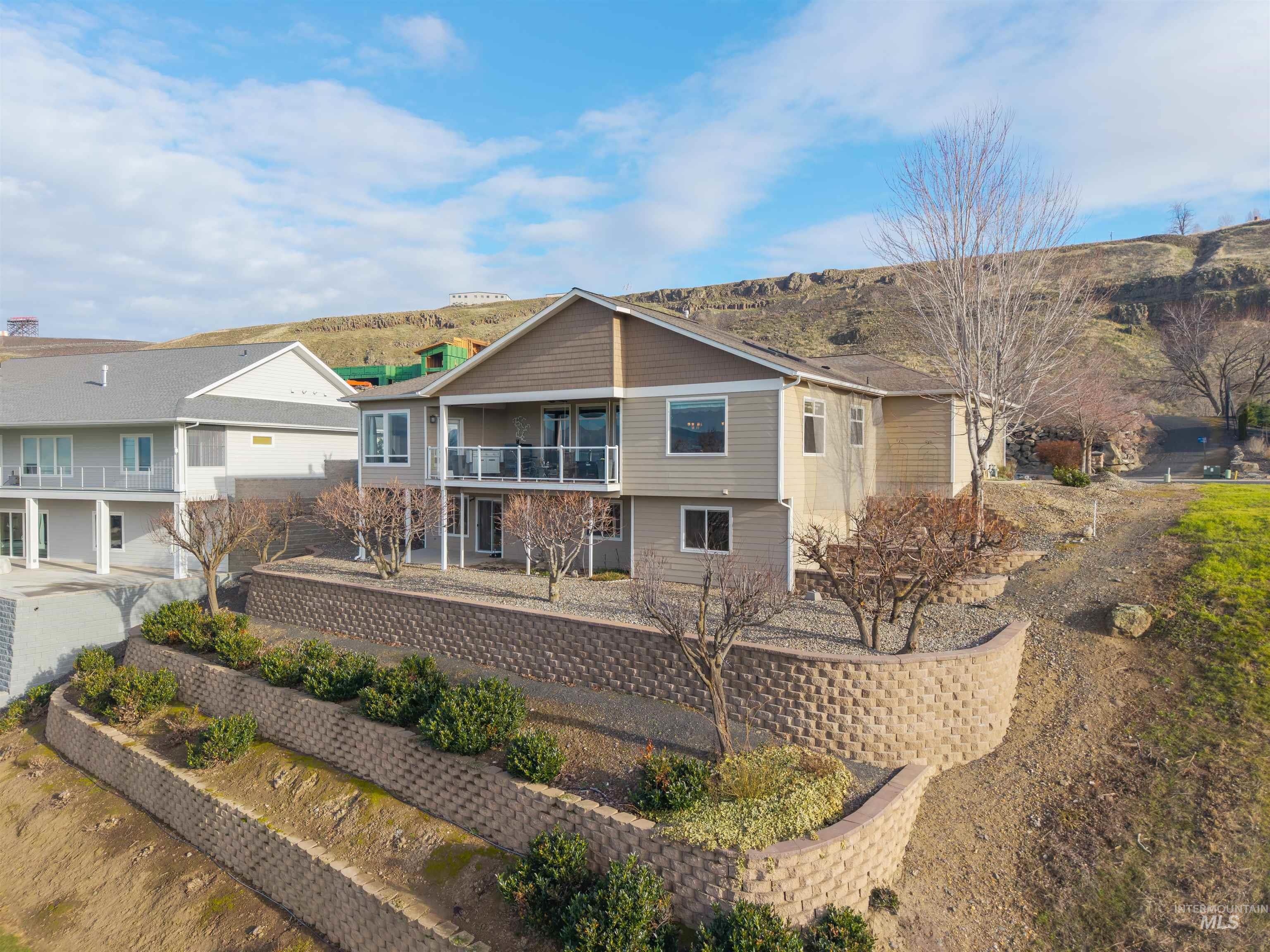 3978 Foothill Drive Lewiston, ID 83501 - Photo 35 of 40 Rear view of house featuring a balcony and a mountain view