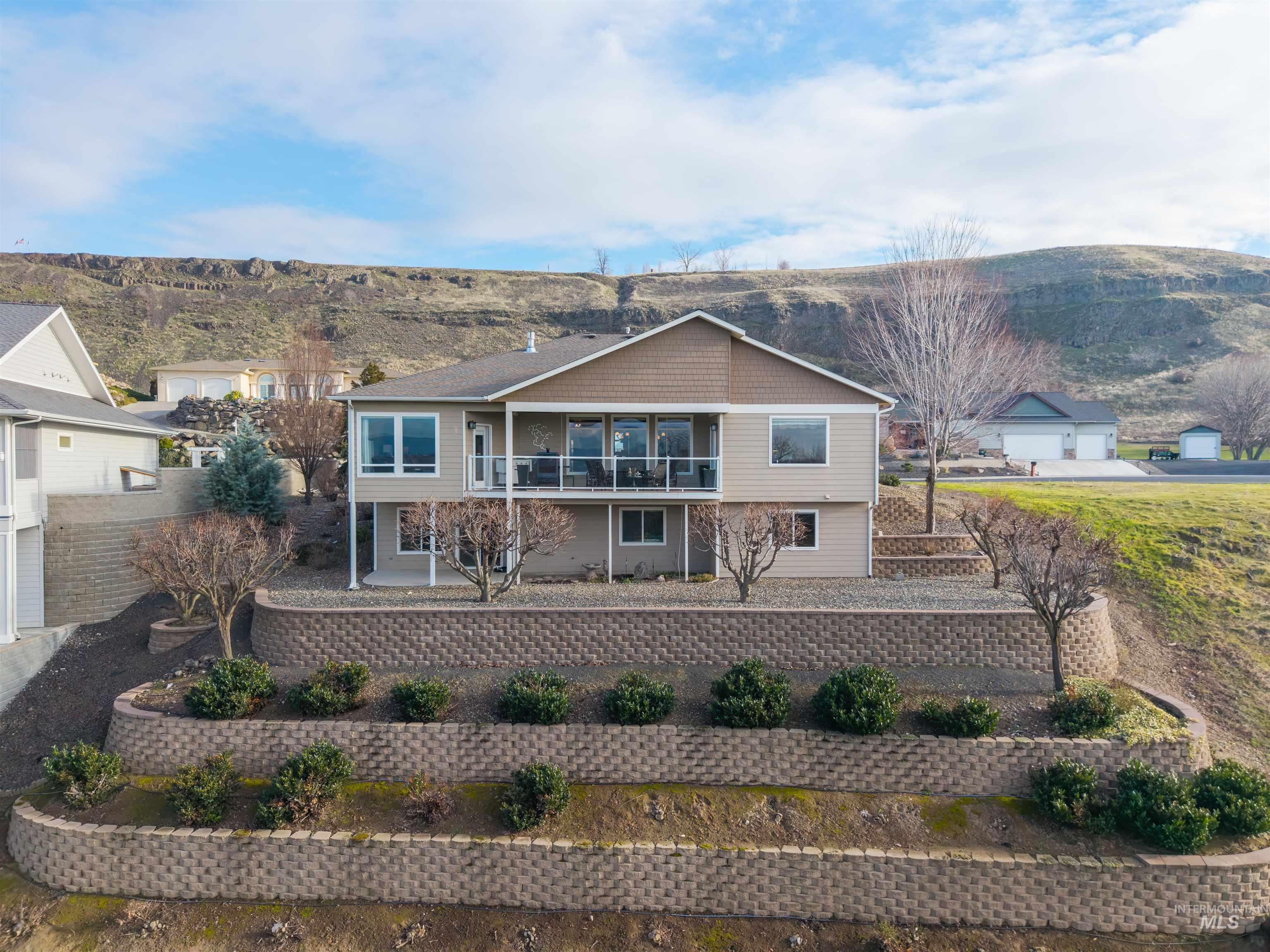 3978 Foothill Drive Lewiston, ID 83501 - Photo 36 of 40 View of front of property featuring a mountain view, a balcony, and a patio