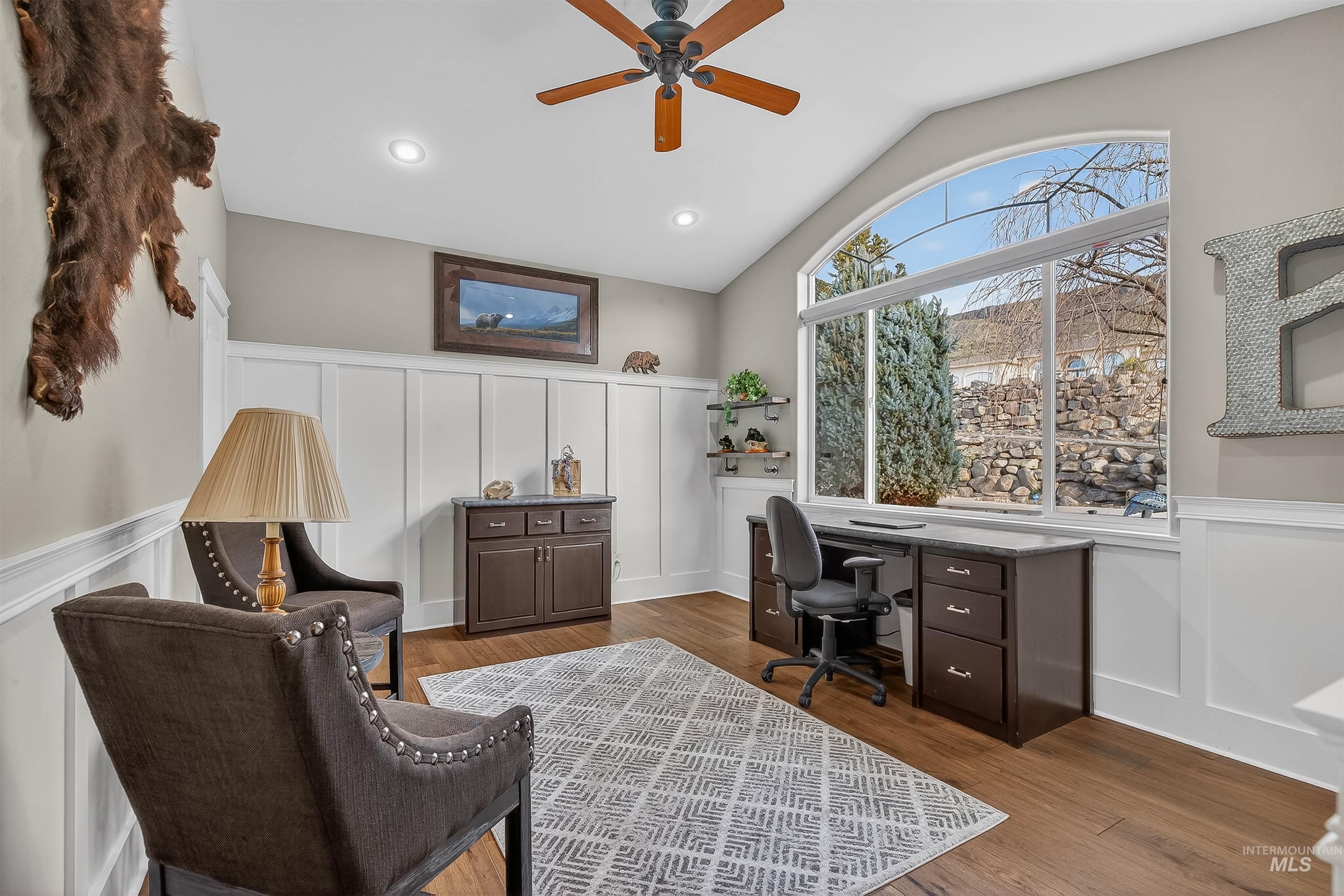 3978 Foothill Drive Lewiston, ID 83501 - Photo 6 of 40 Office featuring a decorative wall, wainscoting, wood finished floors, vaulted ceiling, and a ceiling fan