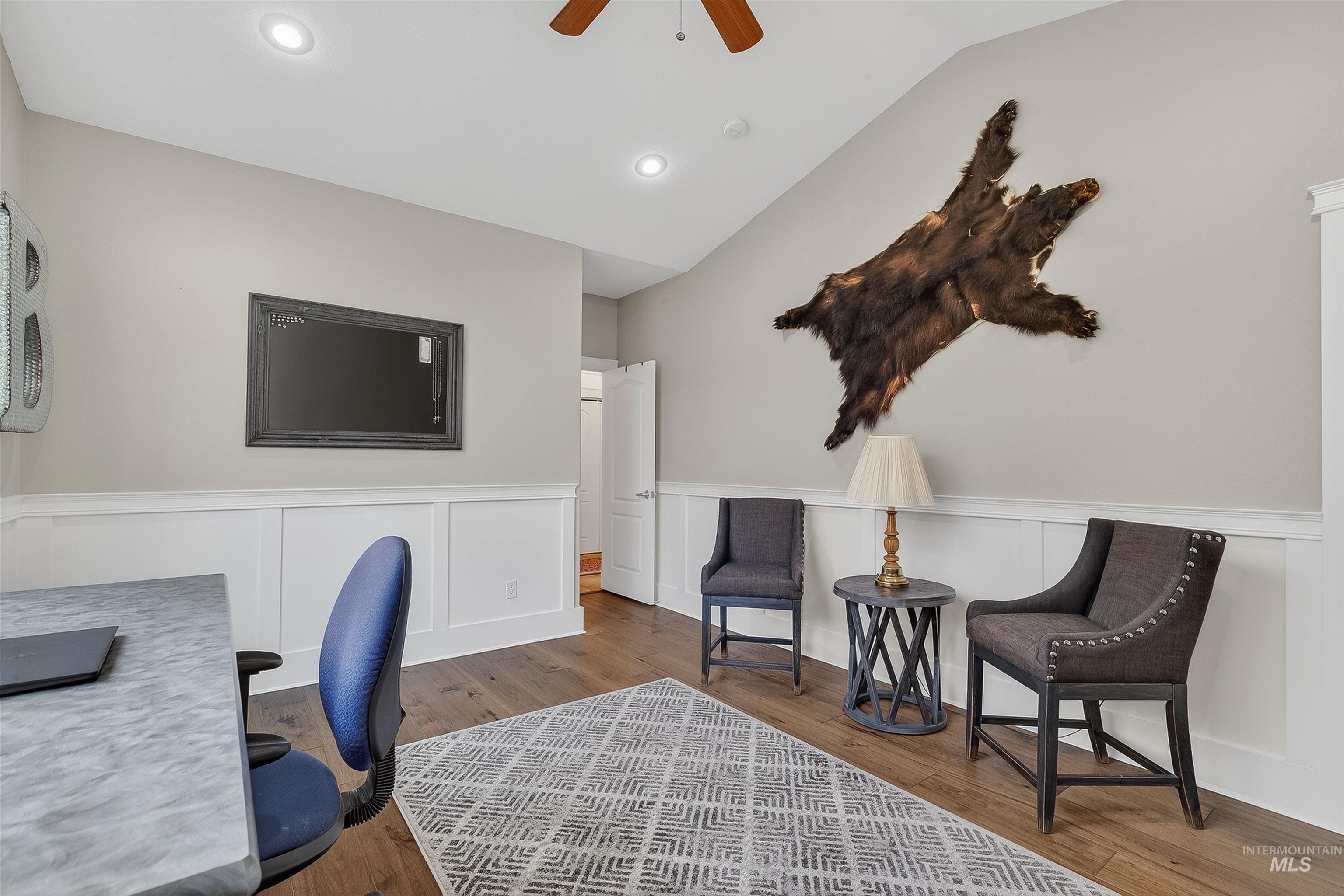 3978 Foothill Drive Lewiston, ID 83501 - Photo 7 of 40 Office space with wainscoting, a decorative wall, ceiling fan, wood finished floors, and lofted ceiling