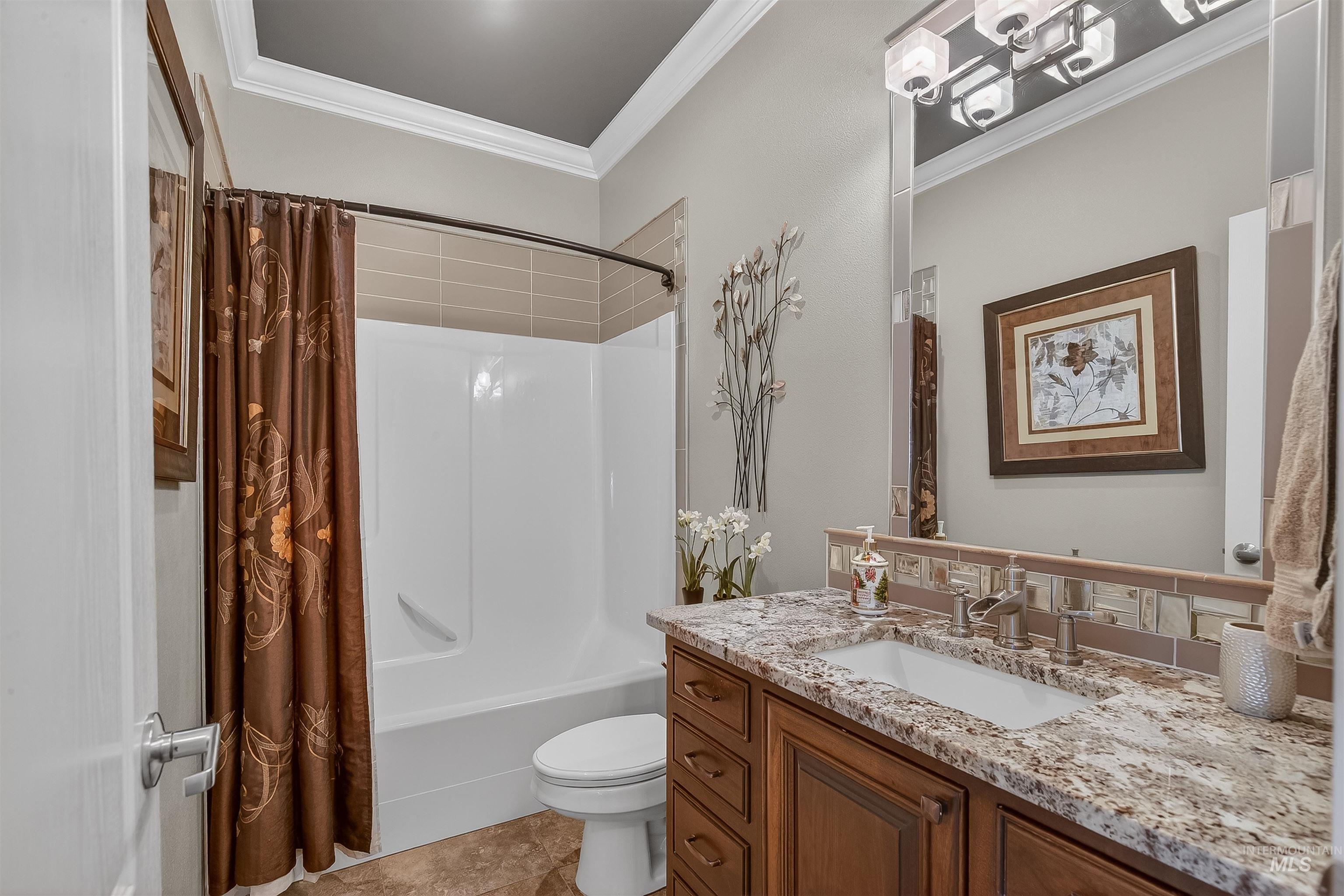 3978 Foothill Drive Lewiston, ID 83501 - Photo 8 of 40 Full bathroom featuring crown molding, vanity, and shower / tub combo