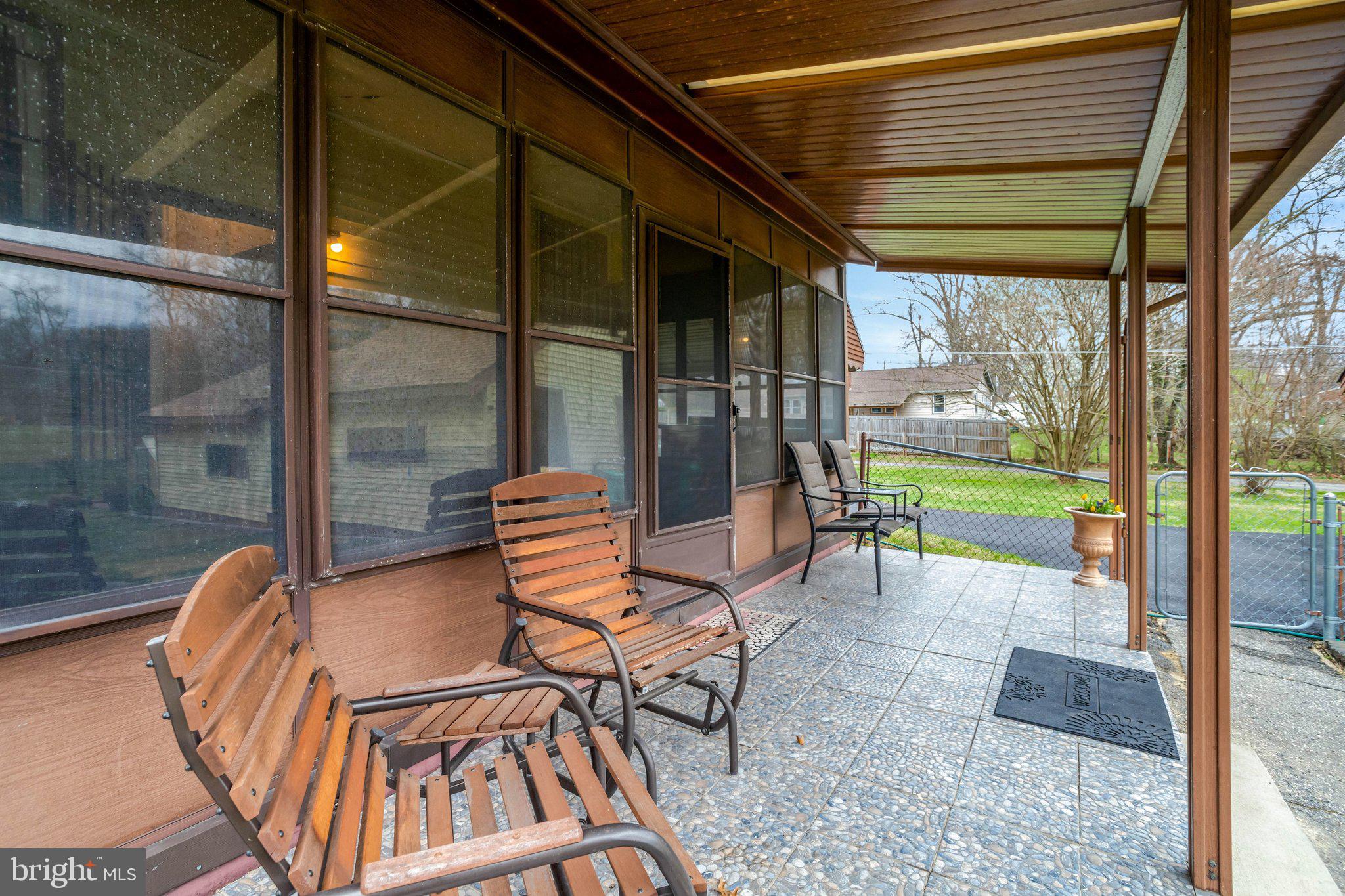 8010 Allentown Road Fort Washington, MD 20744 - Photo 4 of 16 a backyard of a house with dining table and chairs