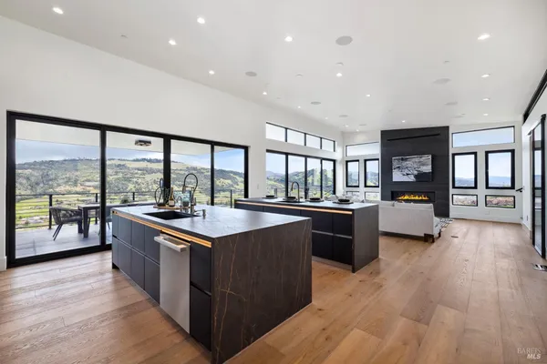 a kitchen with stainless steel appliances granite countertop a stove and a refrigerator