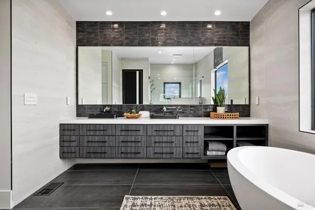 a view of washer and dryer with kitchen in the background