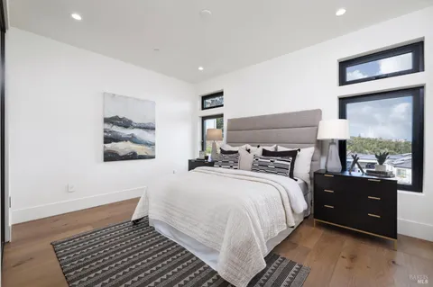 a view of a porch with chairs and backyard