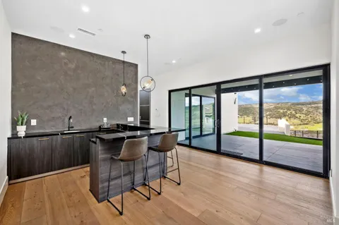 a terrace with outdoor seating and city view