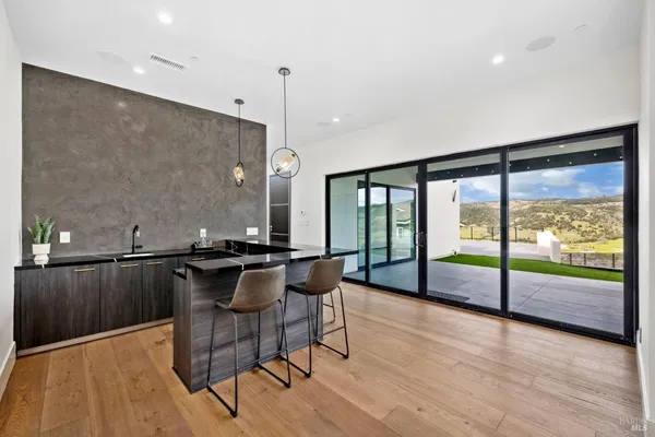 a terrace with outdoor seating and city view