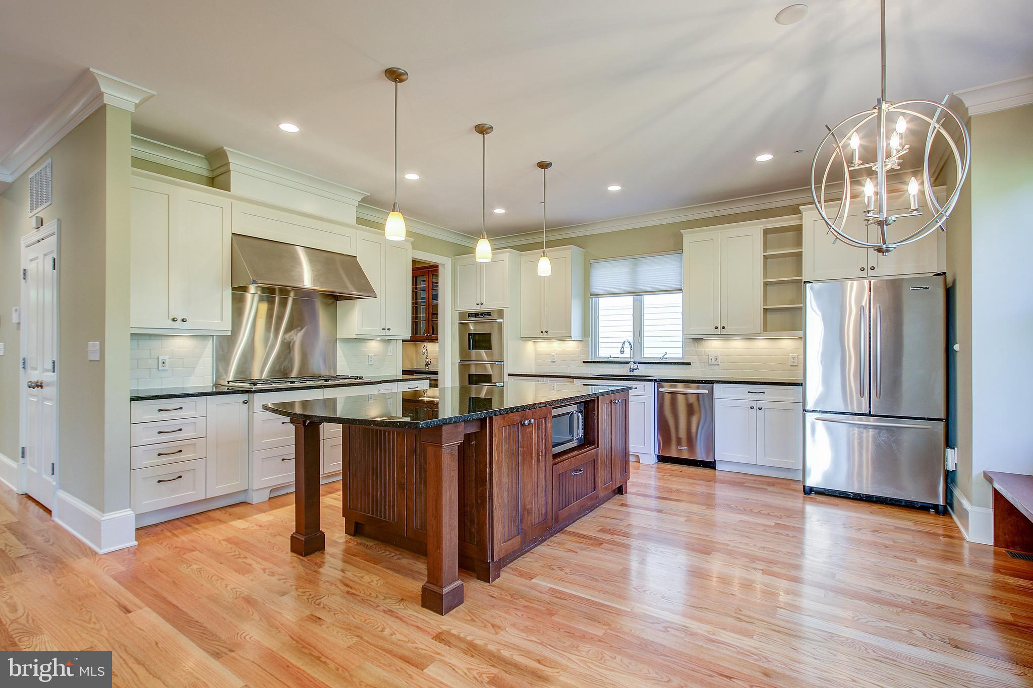 6604 Pyle Road Bethesda, MD 20817 - Photo 8 of 50 KITCHEN W/WHITE CABINETRY & 2 TONE ISLAND