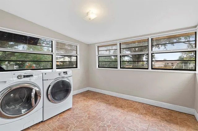 a view of livingroom with washer and dryer