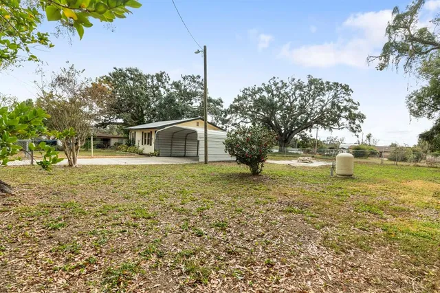 a house view with swimming pool in front of it