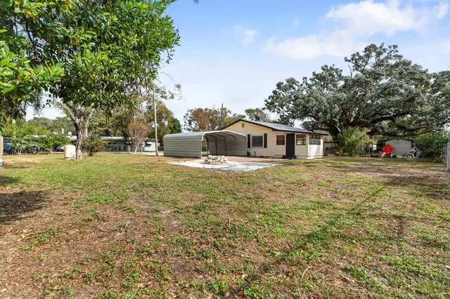 a backyard of a house with lots of green space