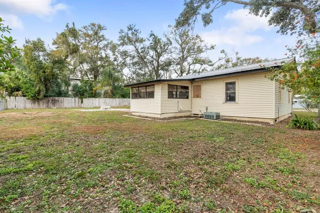 a view of a backyard of the house