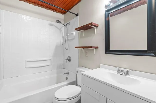 a bathroom with a sink a toilet and a bathtub