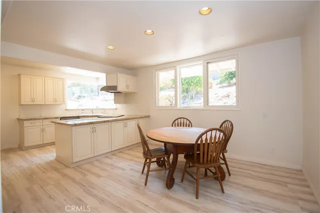a kitchen with granite countertop white cabinets and counter space