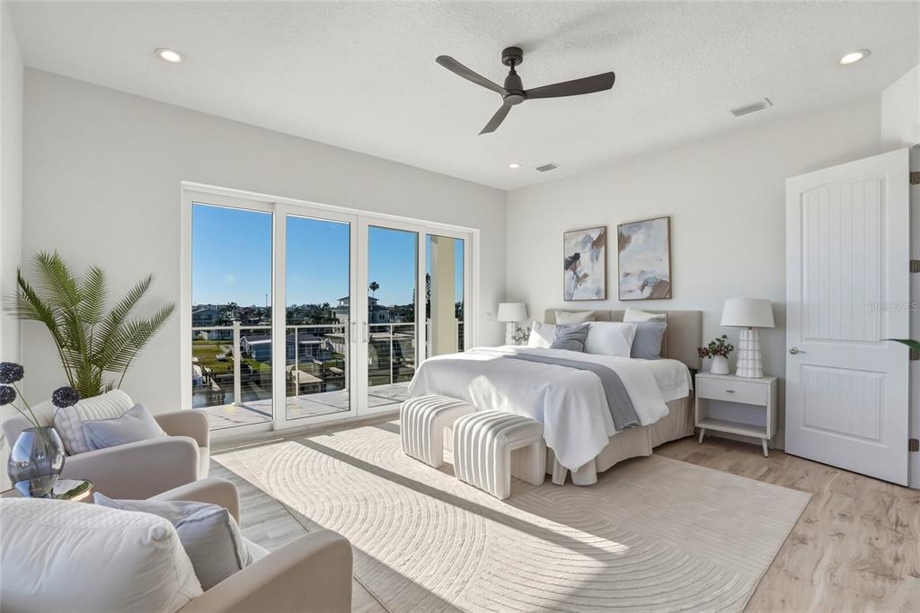 534 Crystal Drive Madeira Beach, FL 33708 - Photo 28 of 68 a spacious bedroom with a large bed and a large window