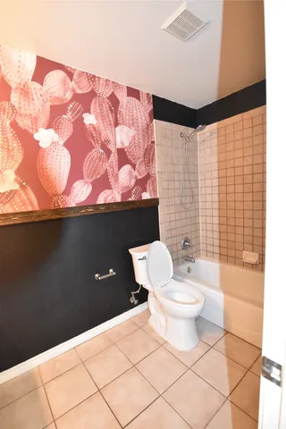 a bathroom with a toilet and a sink