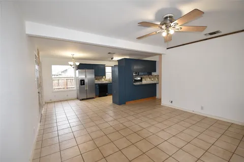 a view of a kitchen with a sink and cabinets