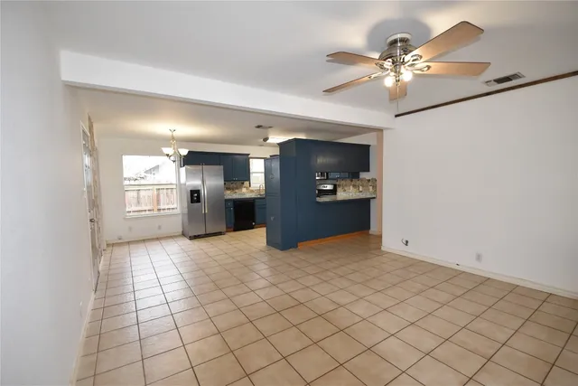 a view of a kitchen with a sink and cabinets