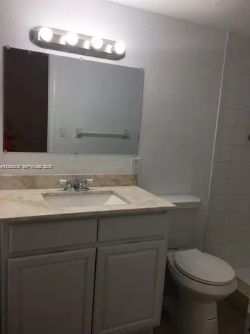 a bathroom with a sink and a toilet