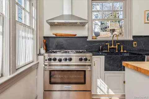 a kitchen with a stove and a microwave