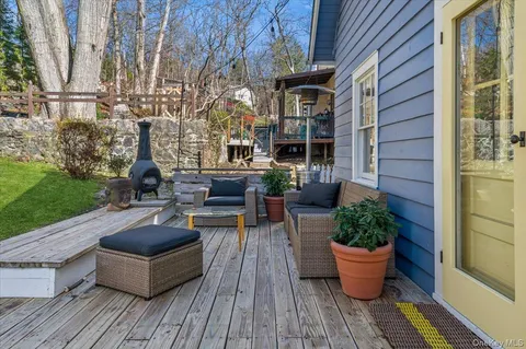 a outdoor space with the couches and potted plants