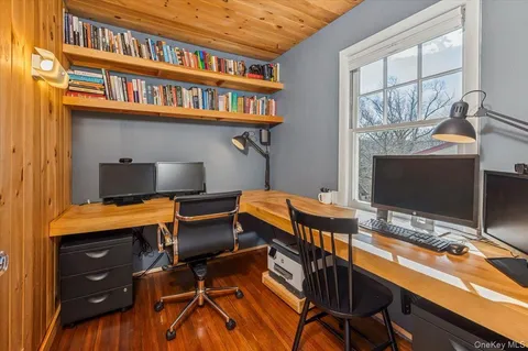 a balcony with table and chairs