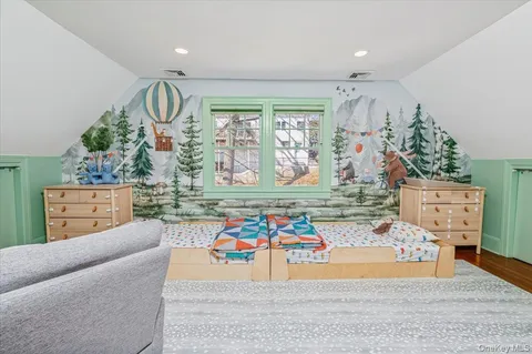 a living room filled with furniture and a large window