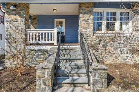 a view of front door of house with a street
