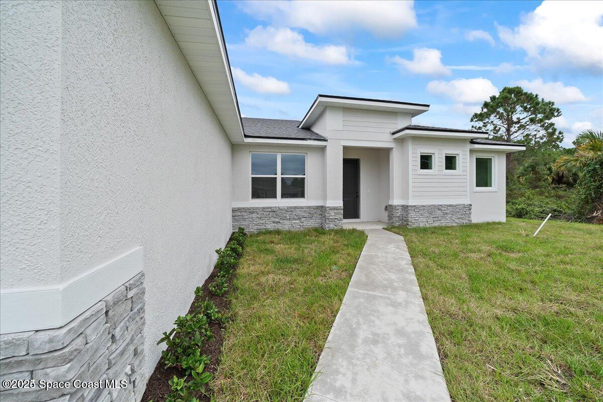 304 Fenton Road Palm Bay, FL 32908 - Photo 31 of 35 fenton sidewalk