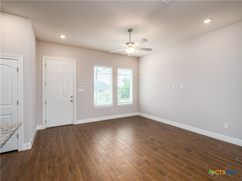 109 High Drive Spring Branch, TX 78070 - Photo 17 of 20 an empty room with wooden floor and windows