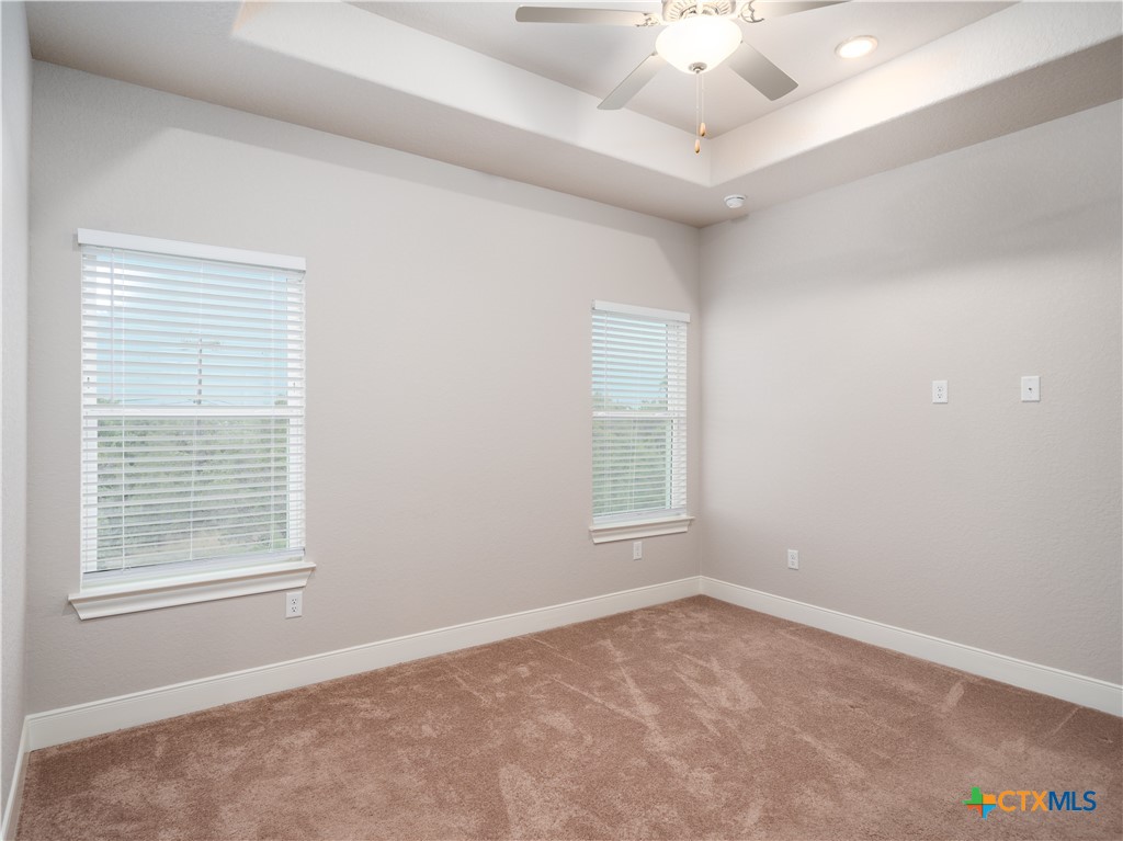109 High Drive Spring Branch, TX 78070 - Photo 5 of 20 an empty room with a window and a ceiling fan