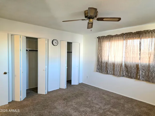 a view of empty room with windows