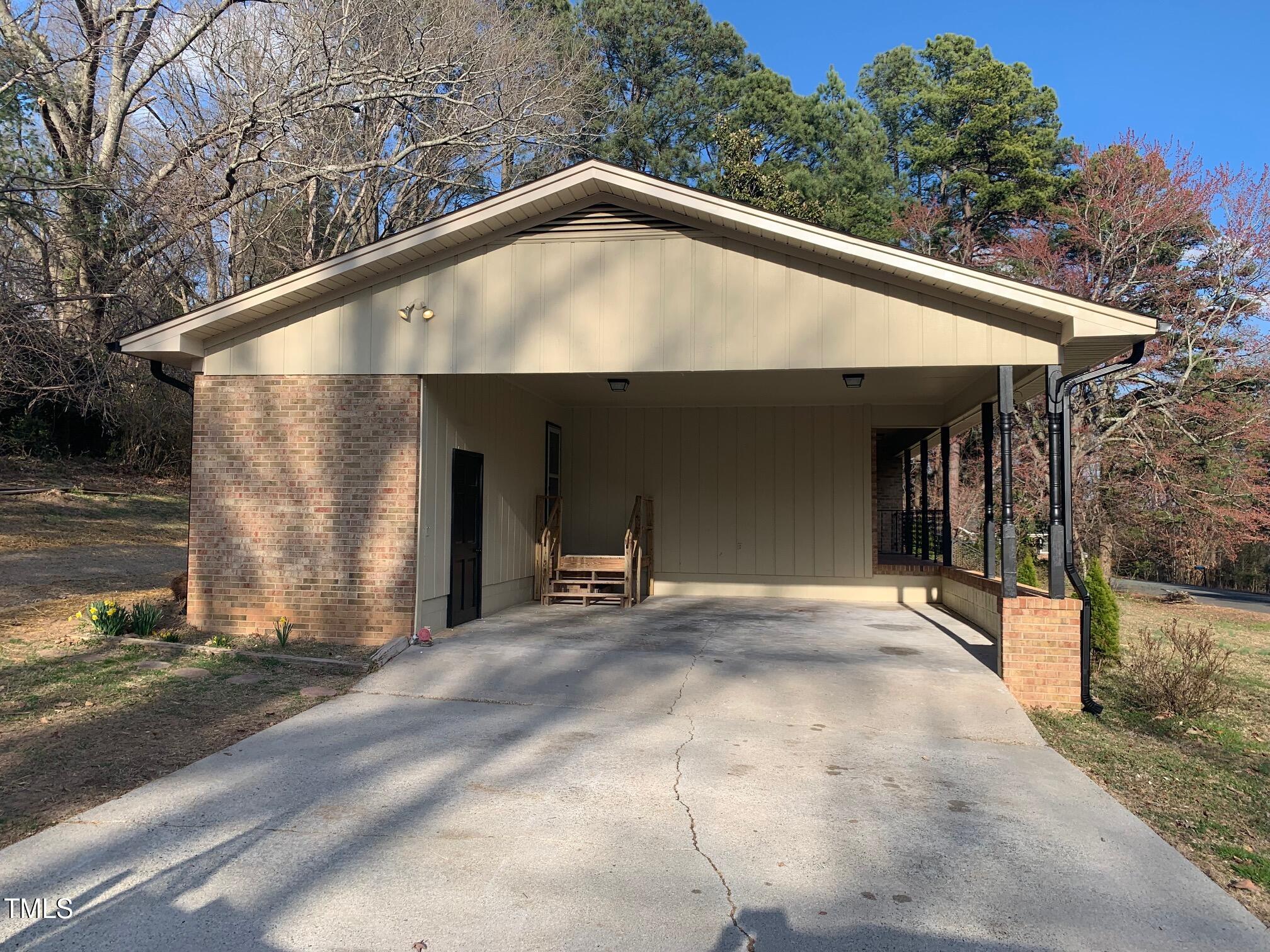209 Reade Drive Roxboro, NC 27573 - Photo 4 of 19 a view of a house with a garage