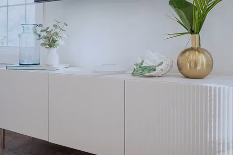 a bathroom with a granite countertop sink a toilet and a bathtub