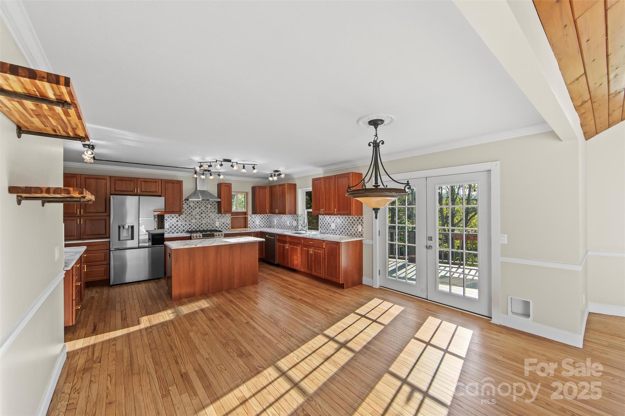 84 Halfmoon Way Clyde, NC 28721 - Photo 11 of 48 a living room with furniture and a wooden floor