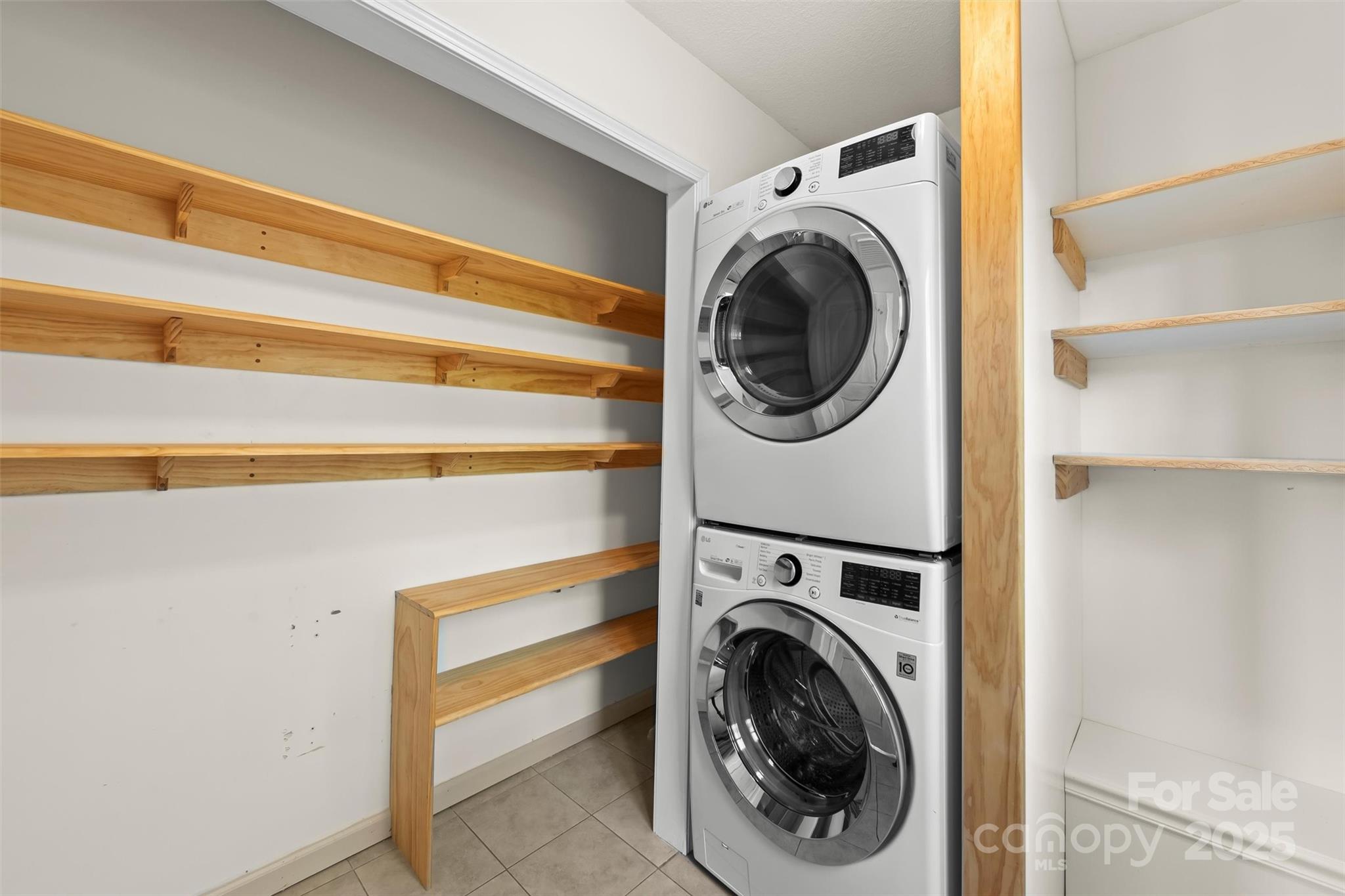 84 Halfmoon Way Clyde, NC 28721 - Photo 17 of 48 a view of a storage & utility room with washer and dryer