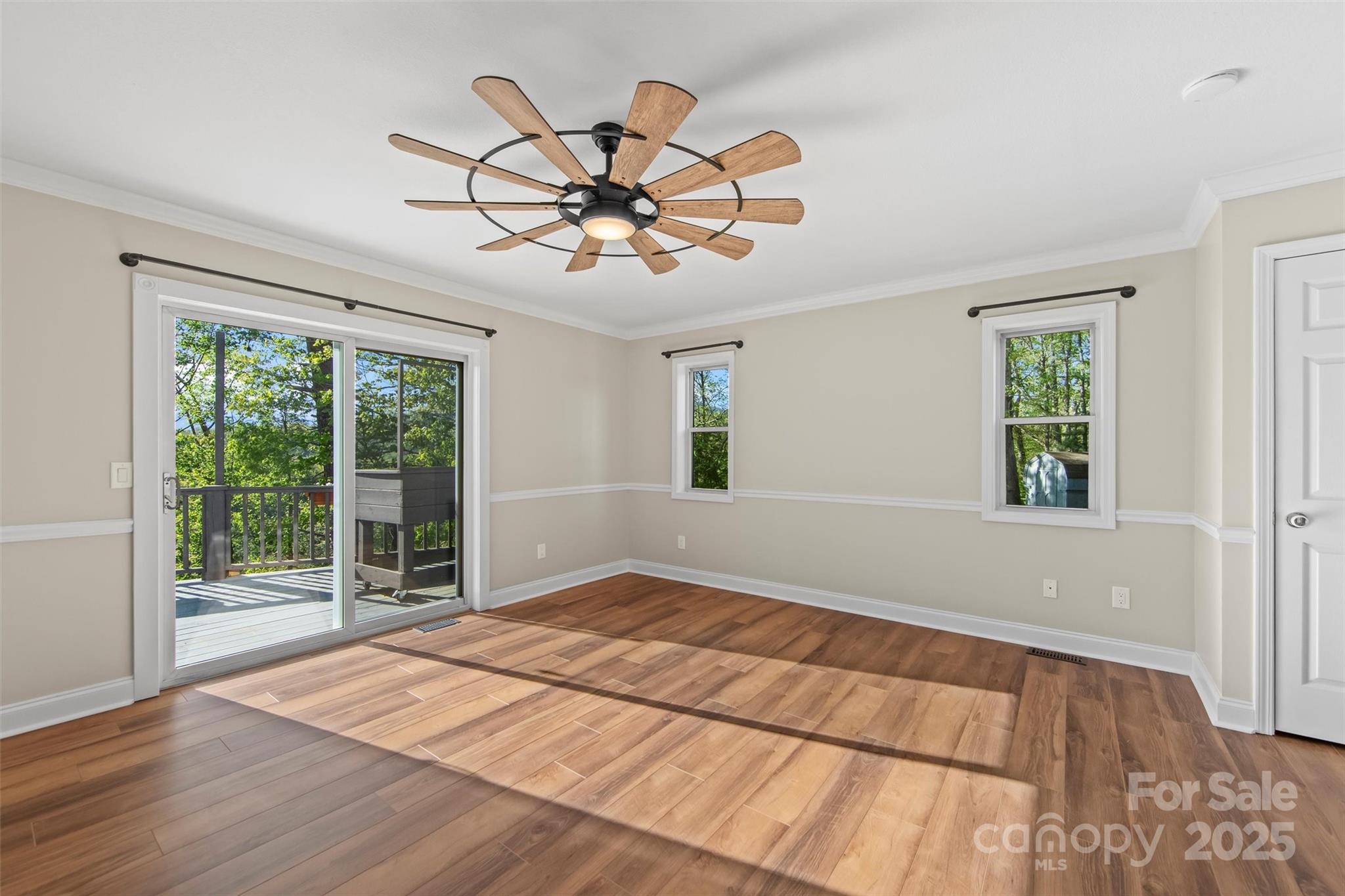 84 Halfmoon Way Clyde, NC 28721 - Photo 18 of 48 a view of a big room with wooden floor and windows