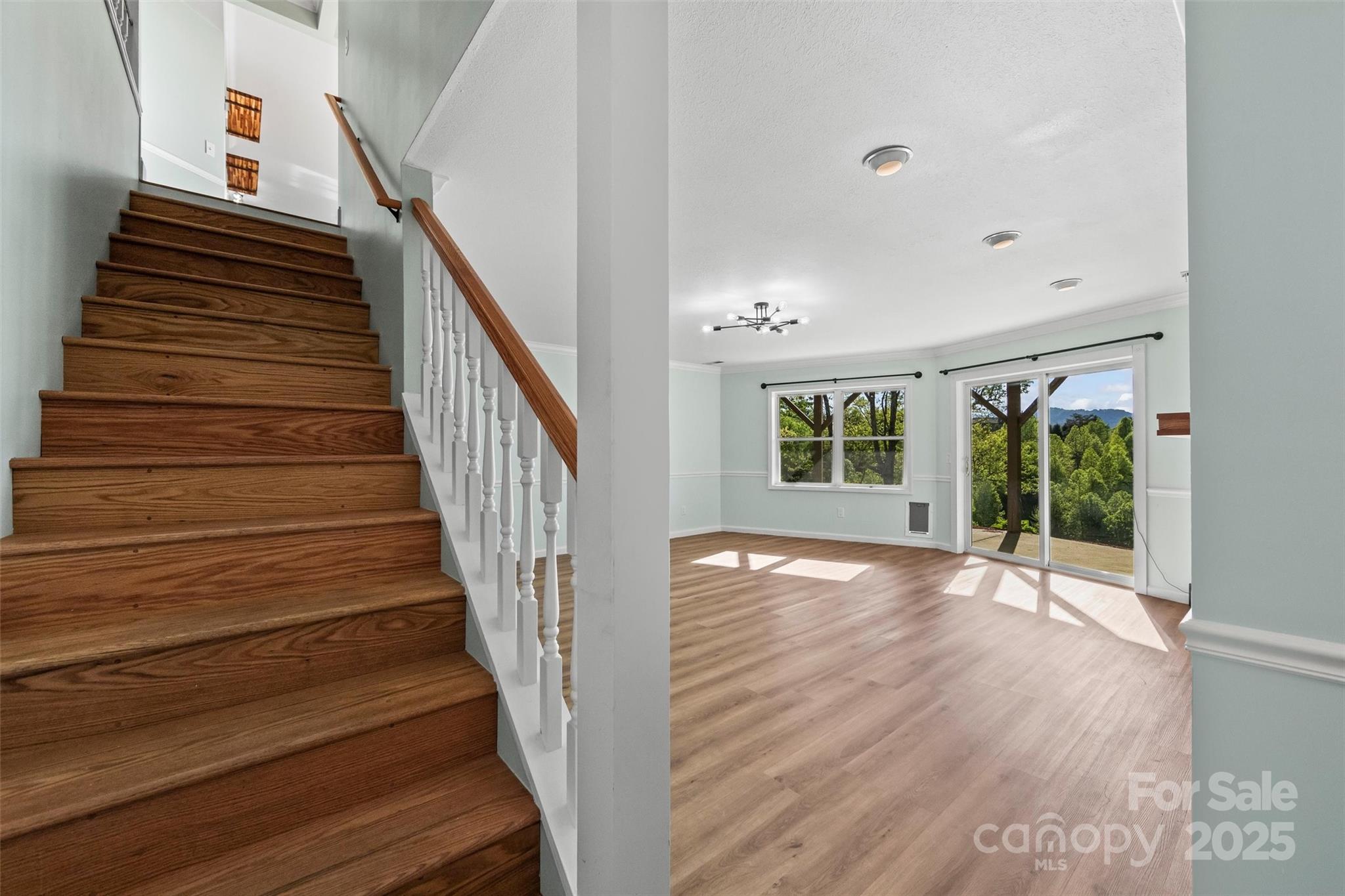 84 Halfmoon Way Clyde, NC 28721 - Photo 28 of 48 a view of an entryway with wooden floor and door