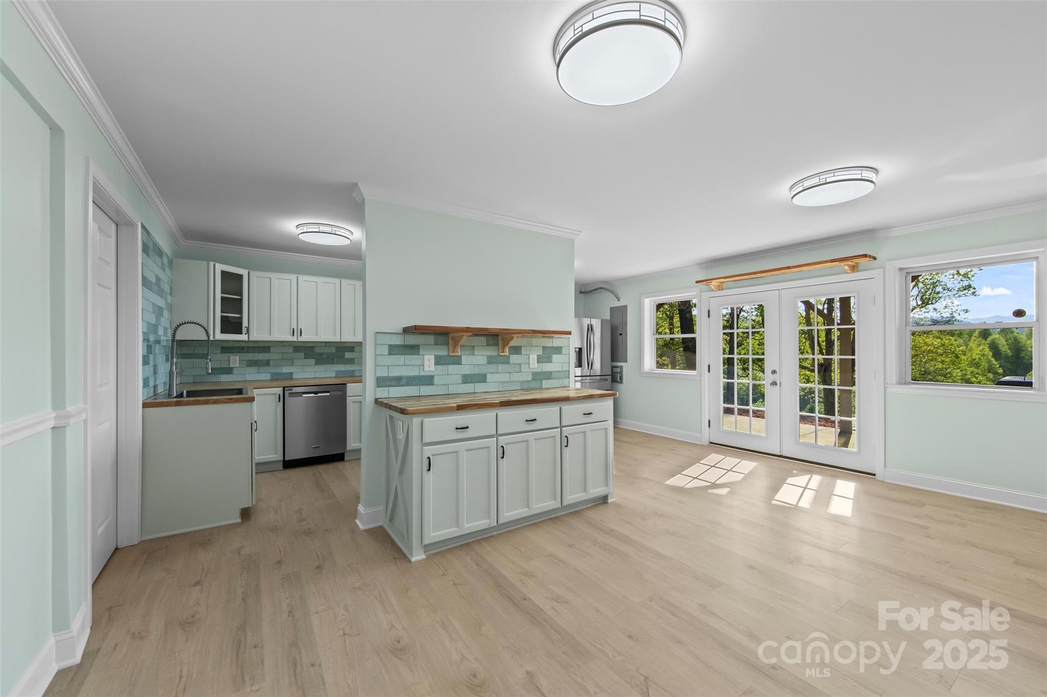 84 Halfmoon Way Clyde, NC 28721 - Photo 31 of 48 a kitchen with granite countertop a stove cabinets and sink