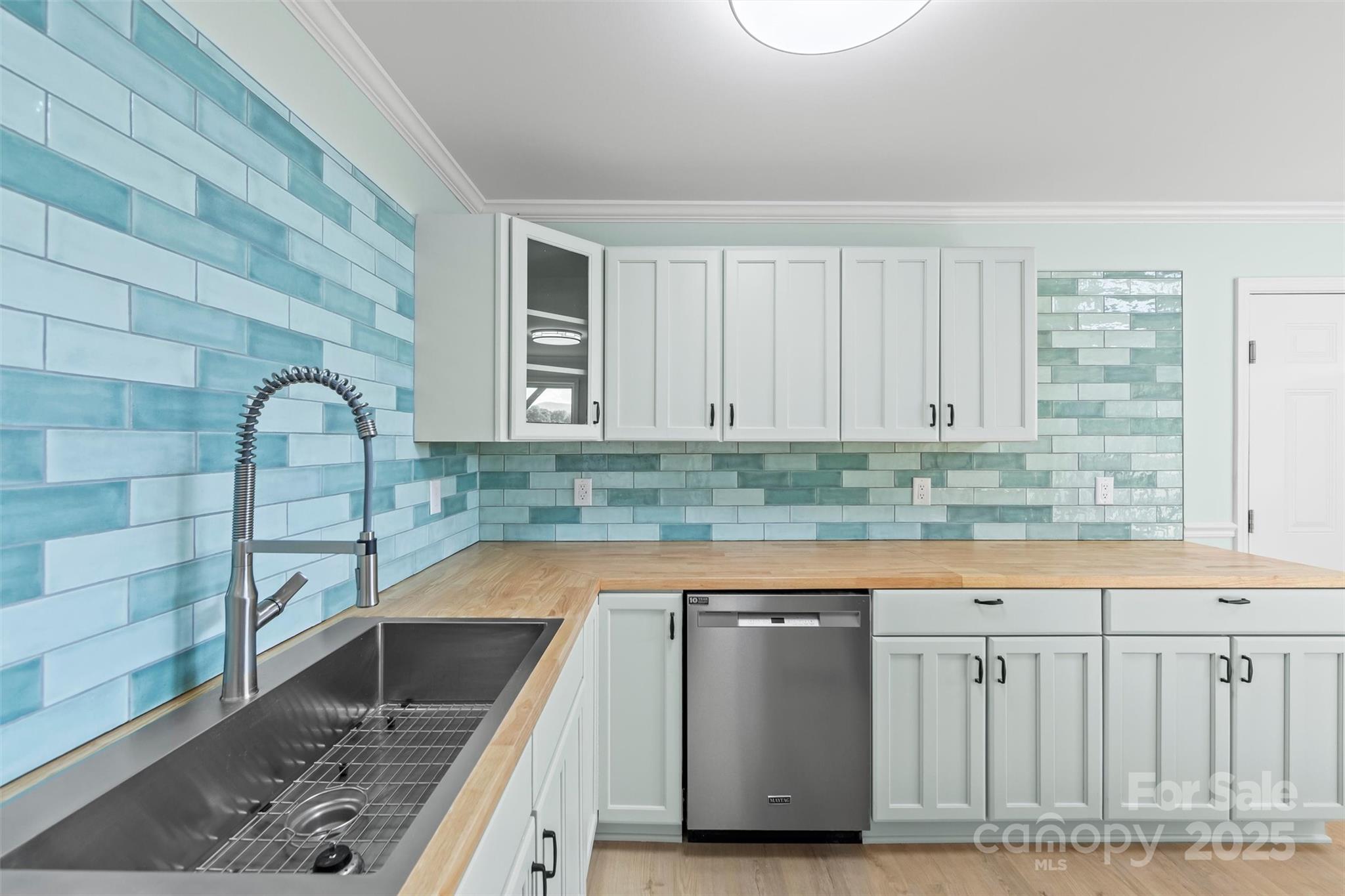 84 Halfmoon Way Clyde, NC 28721 - Photo 34 of 48 a kitchen with granite countertop a sink and a stove