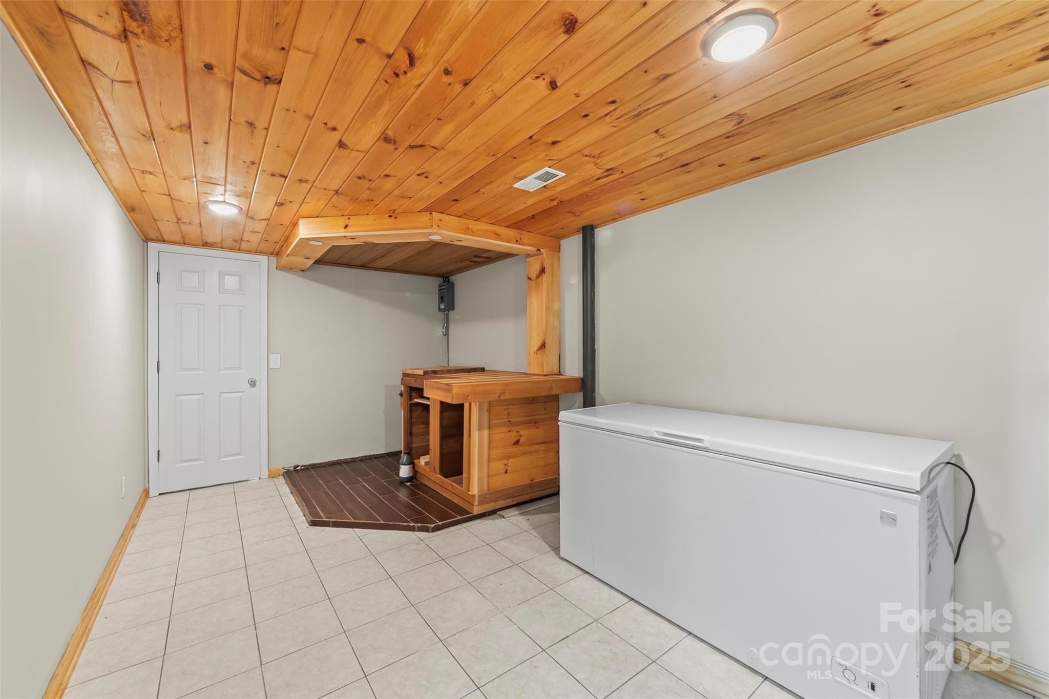 84 Halfmoon Way Clyde, NC 28721 - Photo 37 of 48 a view of a storage & utility room with washer and dryer