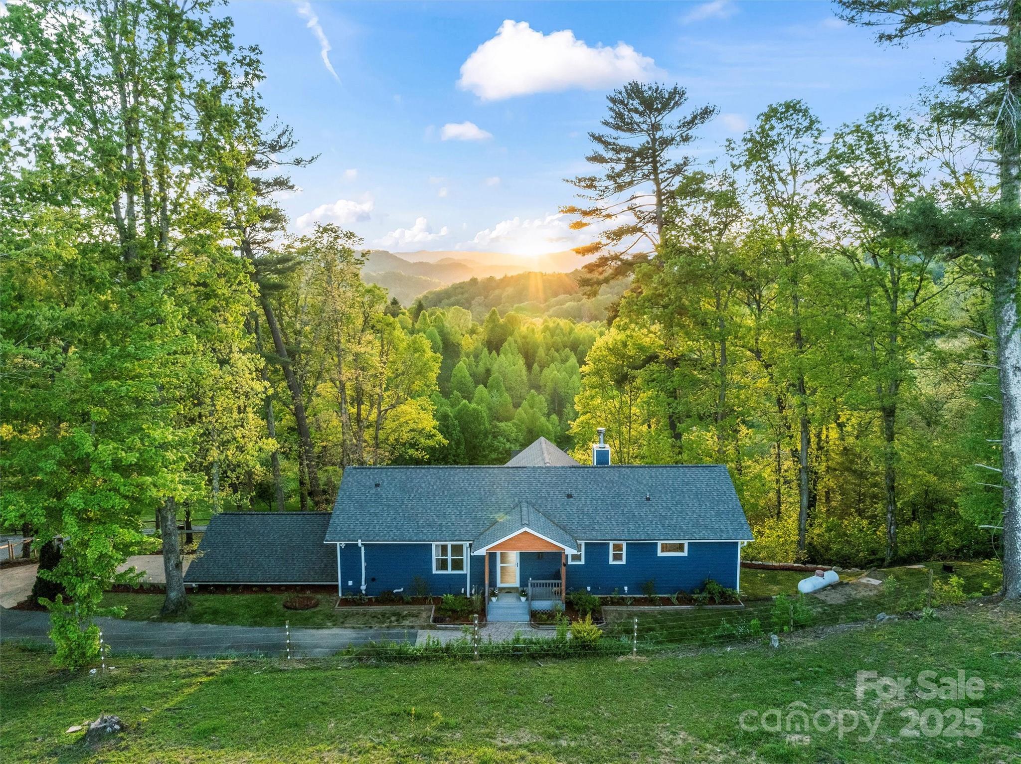 84 Halfmoon Way Clyde, NC 28721 - Photo 4 of 48 an aerial view of a house
