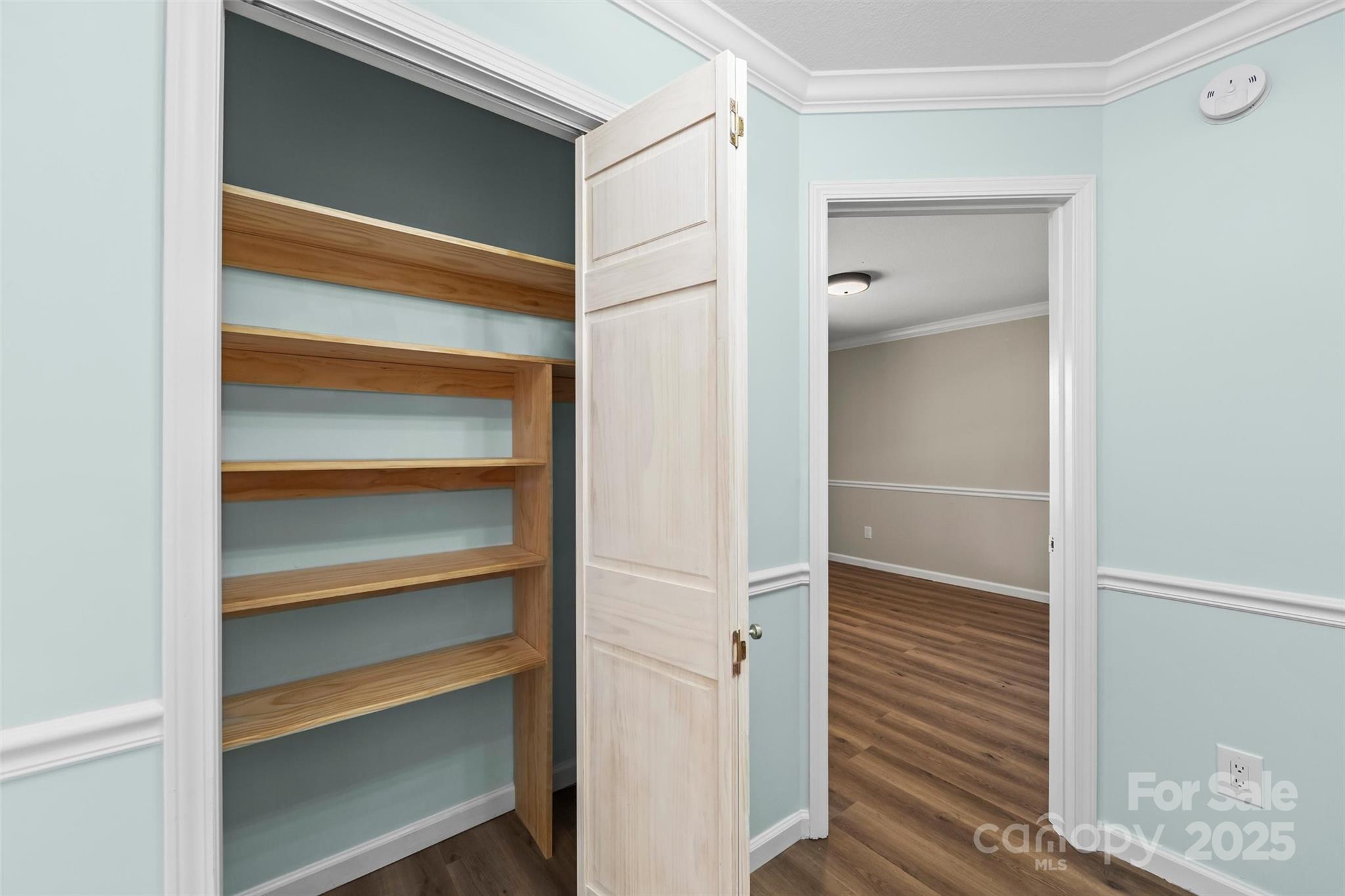 84 Halfmoon Way Clyde, NC 28721 - Photo 42 of 48 a view of walk in closet with empty racks