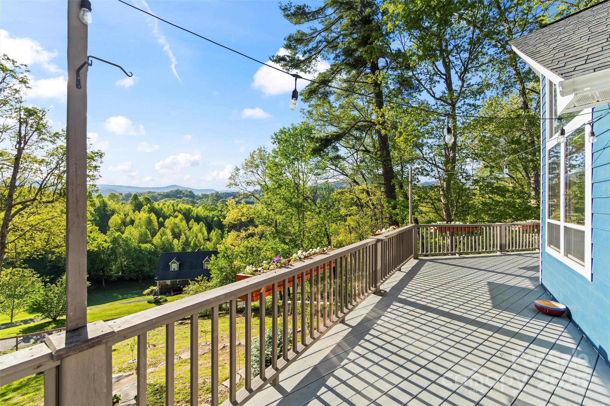 84 Halfmoon Way Clyde, NC 28721 - Photo 44 of 48 a view of a balcony with wooden floor