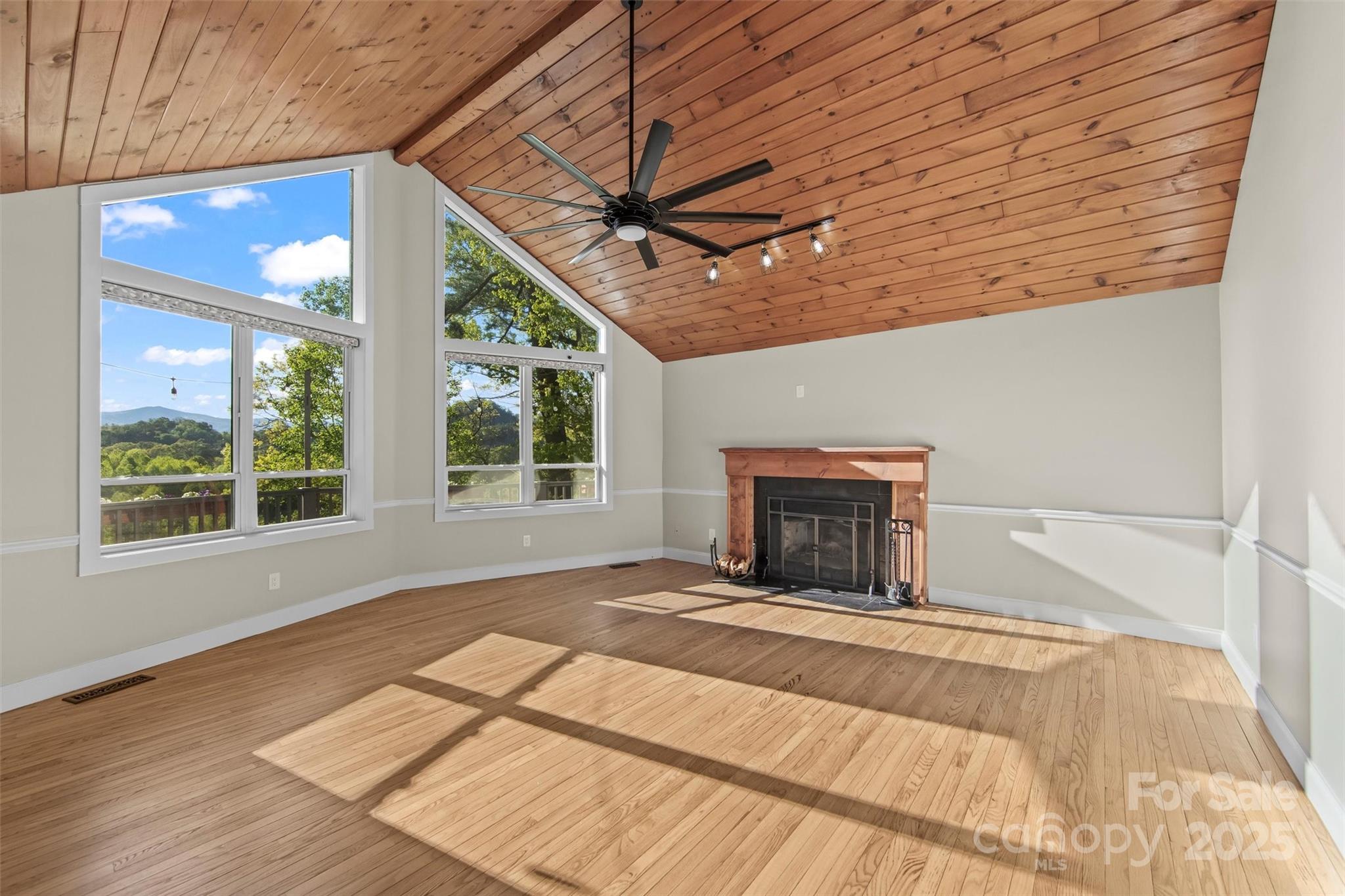 84 Halfmoon Way Clyde, NC 28721 - Photo 9 of 48 a view of a livingroom with a fireplace and window