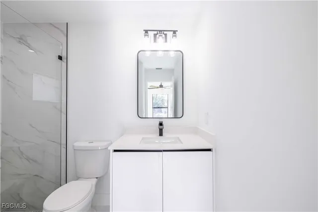 a bathroom with a shower and a window