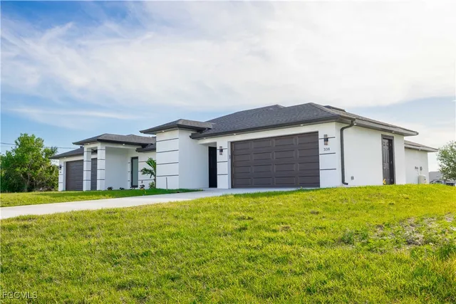 front view of a house with a yard