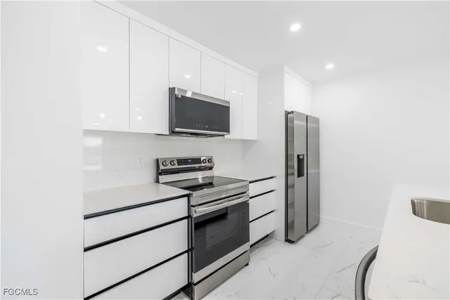 a kitchen with a sink and a window